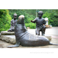 Bronze children boy and girl playing with dolphin sculpture